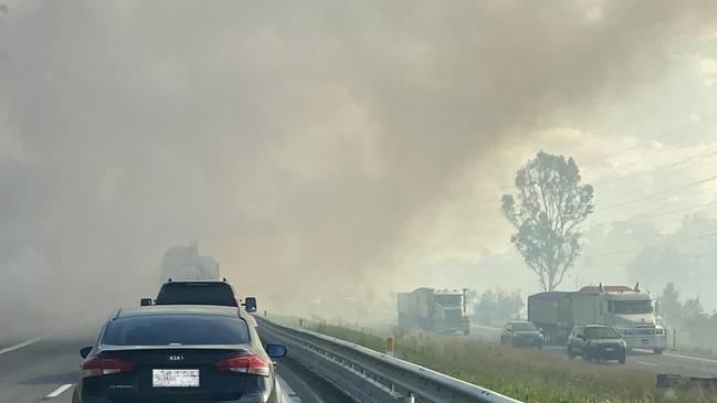 Smoke warning issued for areas around Blackwater near Ipswich as fire can be seen next to the Cunningham Highway. Photo: Ipswich Metal Recycling