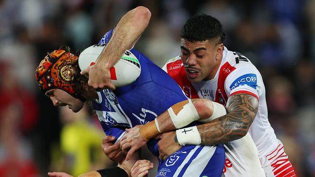 SYDNEY, AUSTRALIA - AUGUST 10: Hame Sele of the Dragons tackles Josh Curran of the Bulldogs during the round 23 NRL match between St George Illawarra Dragons and Canterbury Bulldogs at Netstrata Jubilee Stadium, on August 10, 2024, in Sydney, Australia. (Photo by Jeremy Ng/Getty Images)