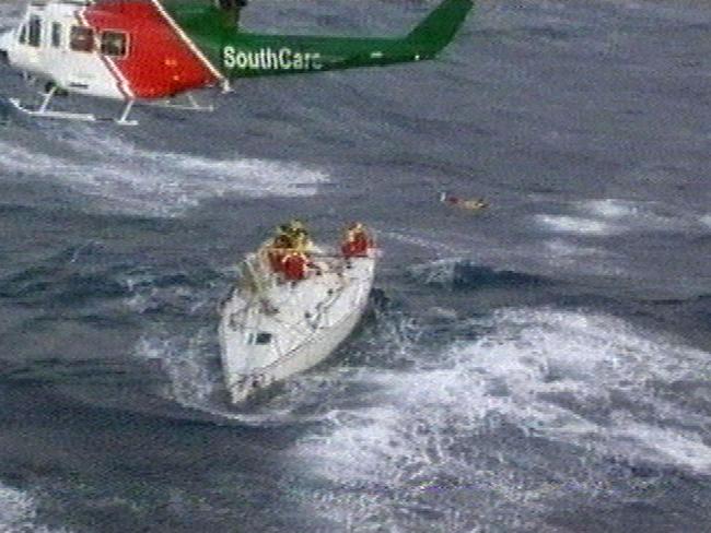 The rescue helicopter hovering over dismasted yacht Sword of Orion.