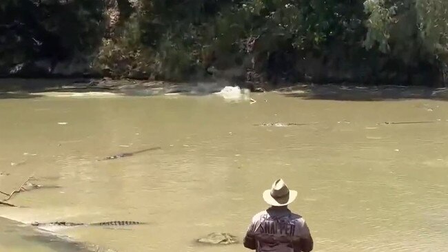 Stills from a video capturing one of two fisherman casting into croc-infested waters at Cahills Crossing in the Northern Territory on September 12, 2023. Pictures: Jody Chisholm