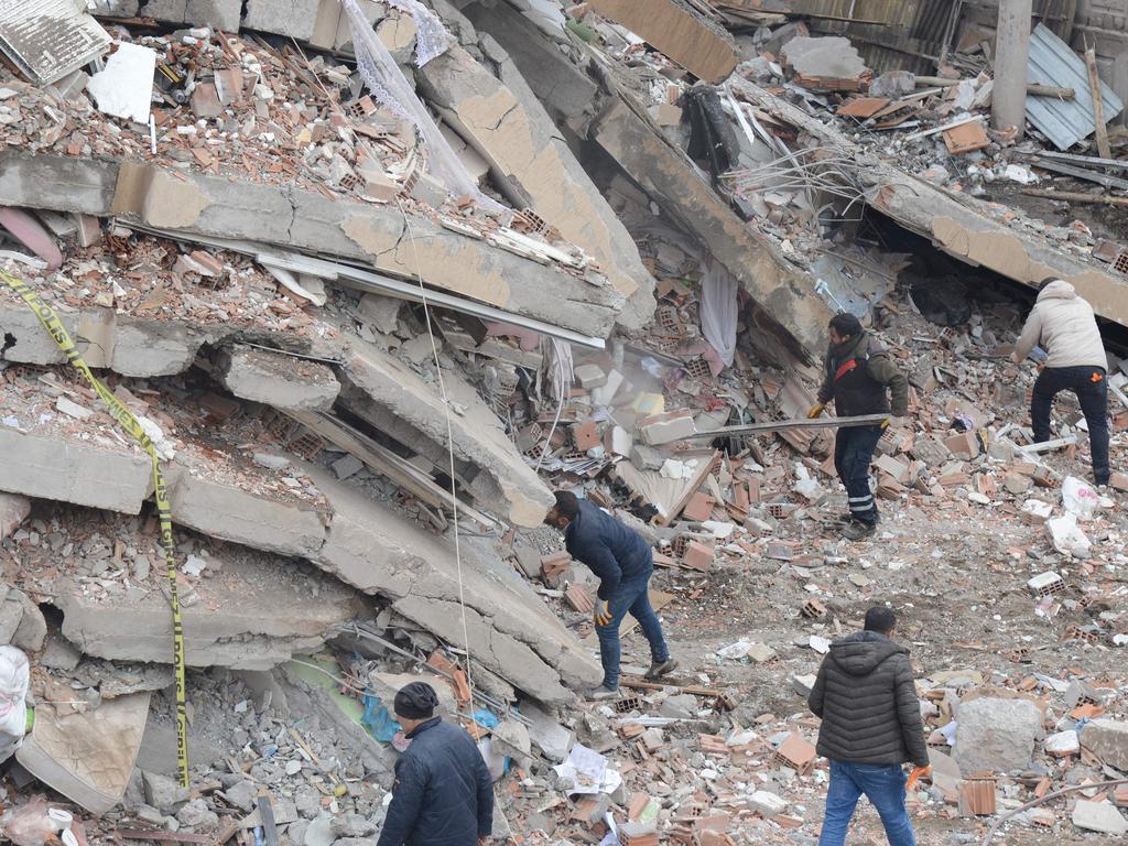 Rescue workers and volunteers conduct search and rescue operations in the rubble of a collapsed building, in Diyarbakir, Turkey. Picture: AFP