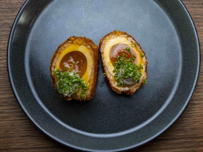 The ramen scotch egg is one of the many superb snacks at Reed House. Picture: Wayne Taylor.