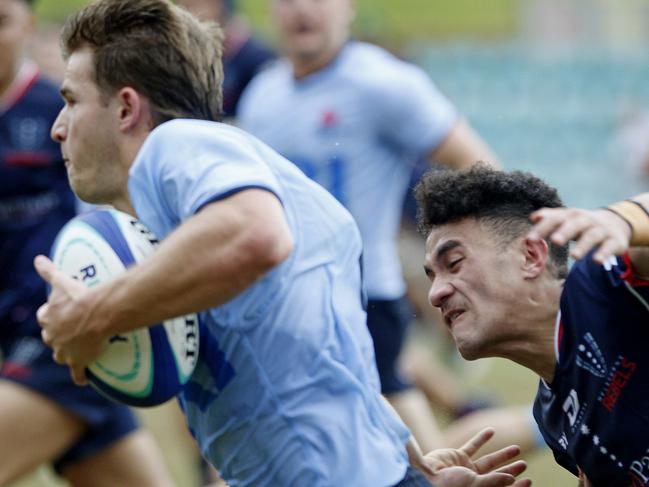 Waratahs' Liam Grover with the ball chased by Melbourne Rebels' Journey Ioane. Under 19s Waratahs  v Melbourne Rebels in Super Rugby National Championships Round 1 at Leichhardt Oval. Picture: John Appleyard.