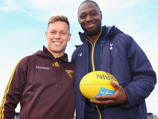 Hawthorn 300-gamer Sam Mitchell and former Tottenham Premier League star Ledley King catch up at Waverley Park. Picture: Getty Images