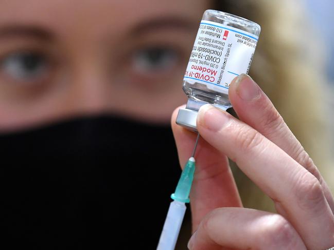 BRISBANE, AUSTRALIA - NewsWire Photos - SEPTEMBER 22, 2021. Intern Pharmacist Alexandra Bradshaw draws the Moderna Covid-19 vaccine into a syringe at a pharmacy in Brisbane. Pharmacies have began administering the Moderna vaccine to anyone over 12 years-old.Picture: NCA NewsWire / Dan Peled