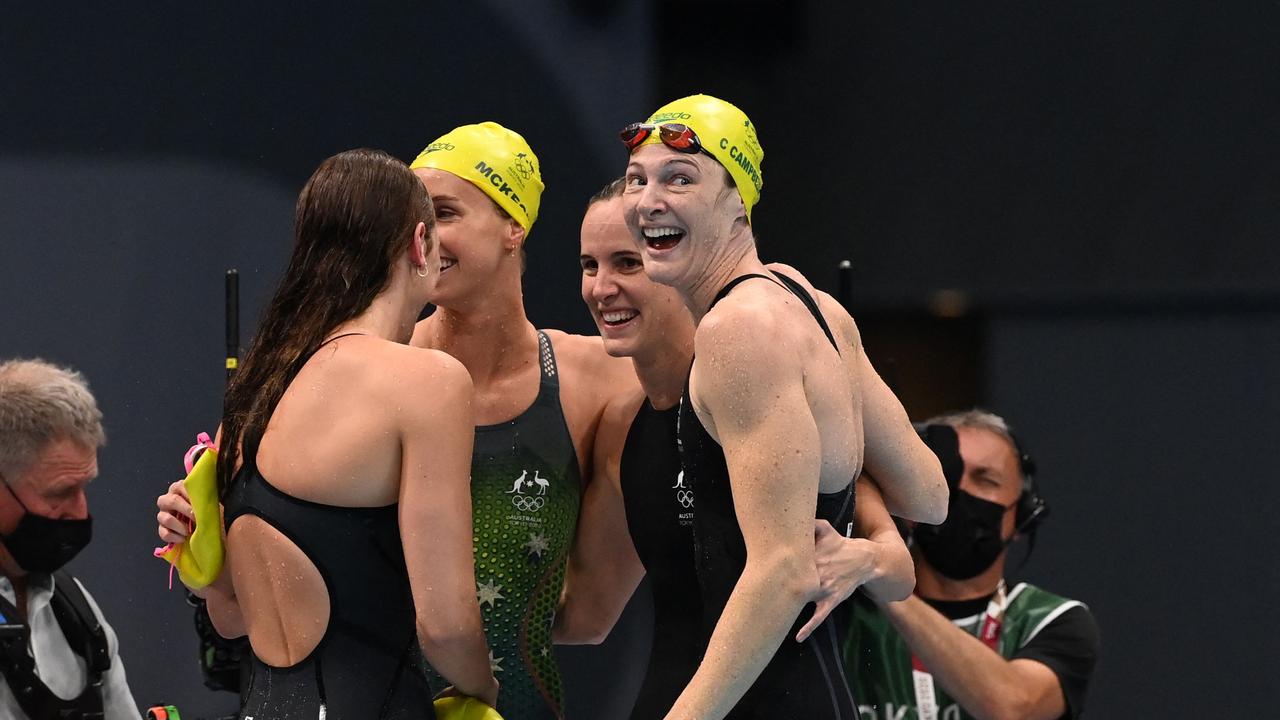 Australia's Cate Campbell and teammates celebrate after setting a world record and winning the final of the women's 4x100m freestyle relay. (Photo by Attila KISBENEDEK / AFP)