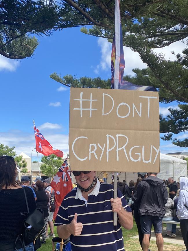 An attendee carries a Trump flag with a sign reading "#dontcryPRguy". Picture: Micaela Stark