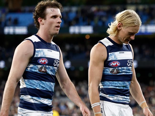 MELBOURNE, AUSTRALIA - APRIL 27: Max Holmes (left) and Oliver Dempsey of the Cats look dejected after a loss during the 2025 AFL Round 07 match between the Carlton Blues and the Geelong Cats at the Melbourne Cricket Ground on April 27, 2025 in Melbourne, Australia. (Photo by Michael Willson/AFL Photos via Getty Images)