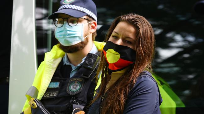 A woman is arrested by police ahead of the rally. Picture: Matrix.