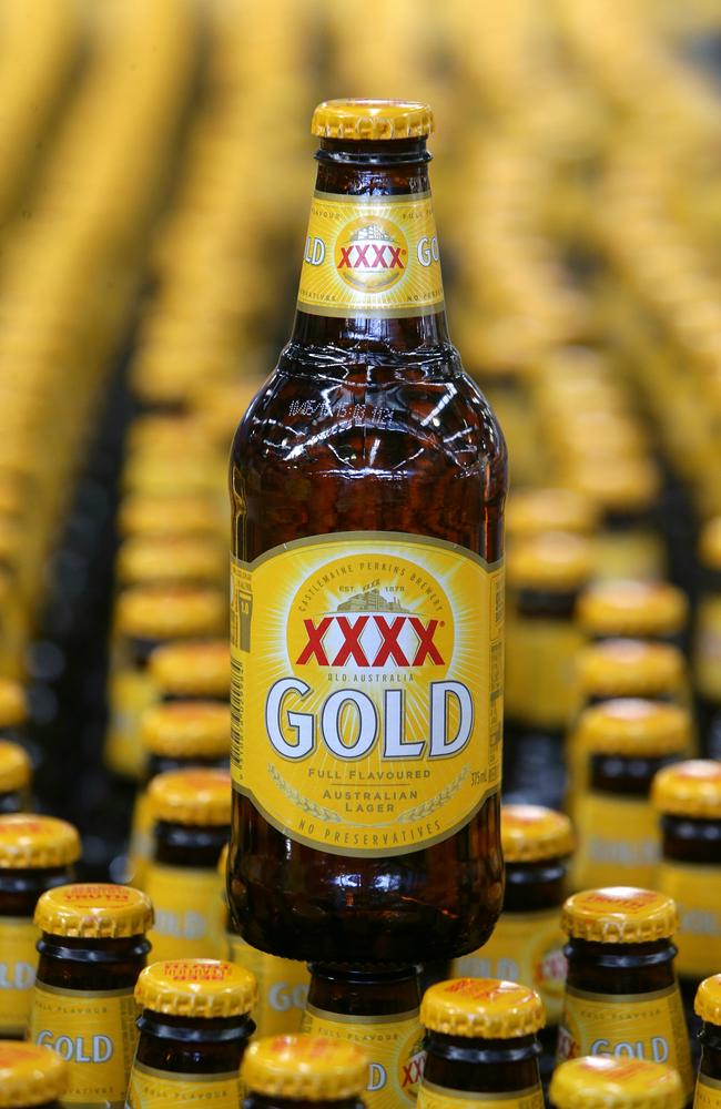 XXXX packaging Analyst Nick McKay with the newly labelled XXXX Gold bottle. Pic Peter Wallis