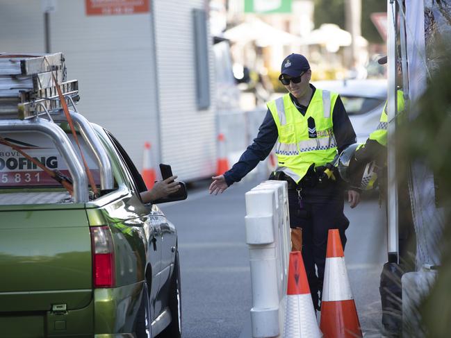 Police checking people at the Queensland border.Picture: NIGEL HALLETT