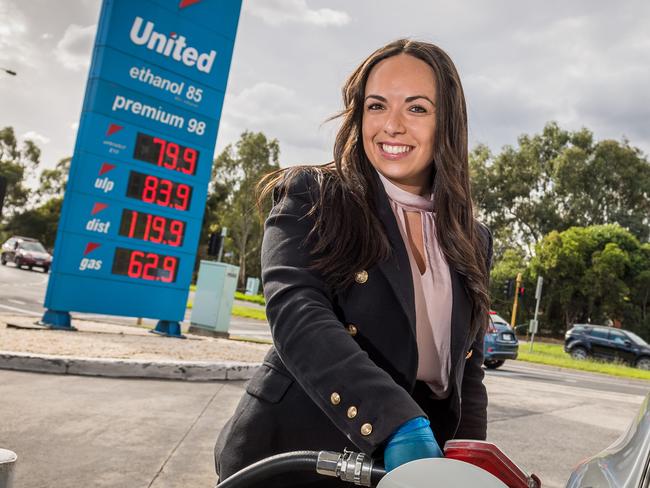 Adele Mirabella fills up with cheap fuel at a United Petrol Station in Kew. (contact: 0422570429). Picture: Jake Nowakowski