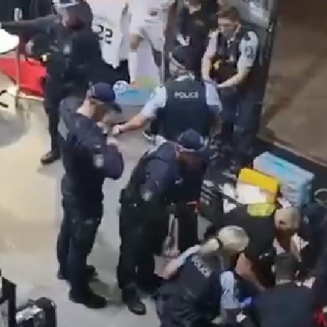 Police and emergency services attend to the brothers after they were shot multiple times. Picture: Supplied