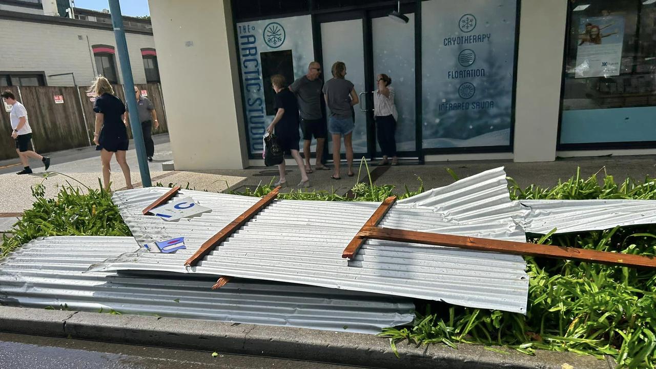 The roof of a cafe lies on the ground.