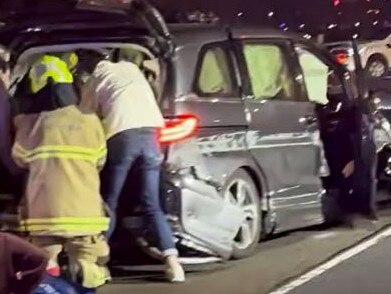 Firefighters and paramedics at the scene on Sunday night. Picture: Andrew Faram