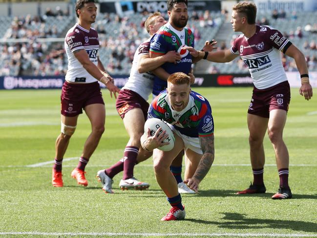 Adam Keighran of the Warriors bursts through to score a try. Picture: Matt King/Getty Images