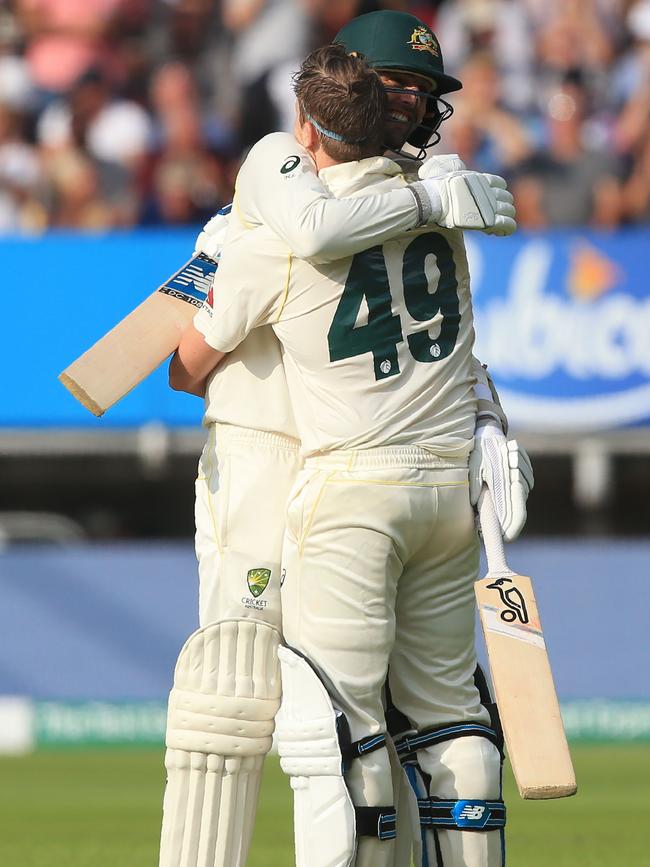 Steve Smith celebrates his century with teammates. Picture: AFP.