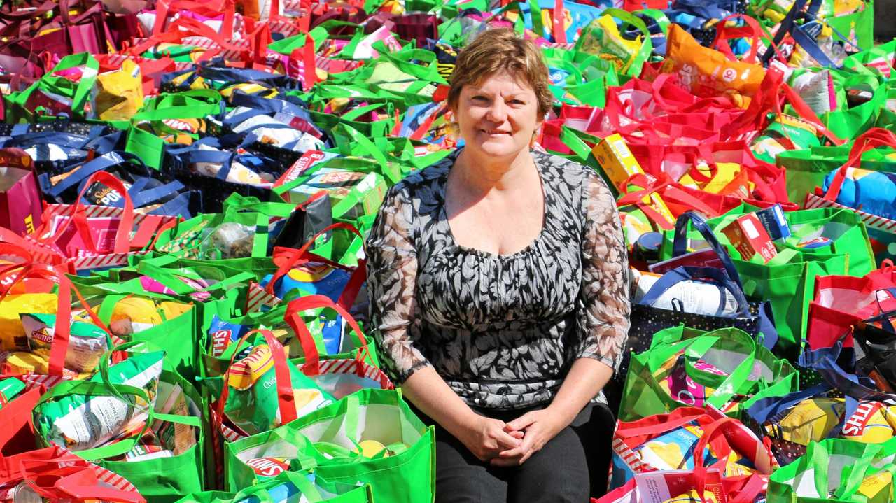 HELP: Cr Janelle Stanford with the 142 hampers put together for the Christmas appeal. Picture: Maranoa Regional Council