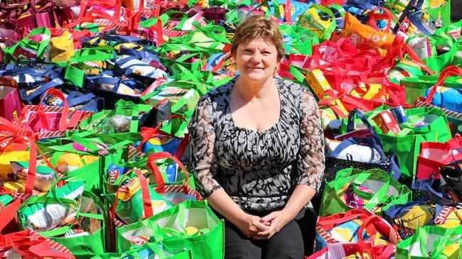 HELP: Cr Janelle Stanford with the 142 hampers put together for the Christmas appeal. Picture: Maranoa Regional Council