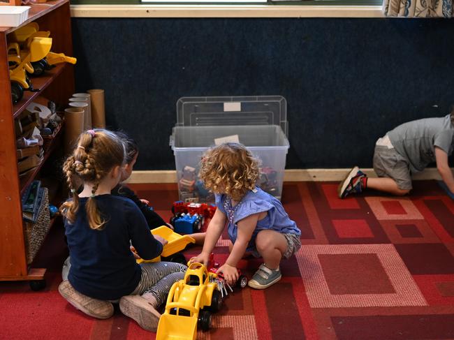 A small group of children play at the Robertson Street Kindy Childcare Centre in Helensburgh south of Sydney, Friday, April 3, 2020. The Federal Government announced that child care would be free for anyone who has a job and is still working during the COVID-19 Coronavirus crisis. (AAP Image/Dean Lewins) NO ARCHIVING