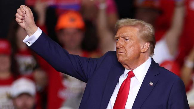 Donald Trump gestures at the end of a campaign rally in Pittsburgh.