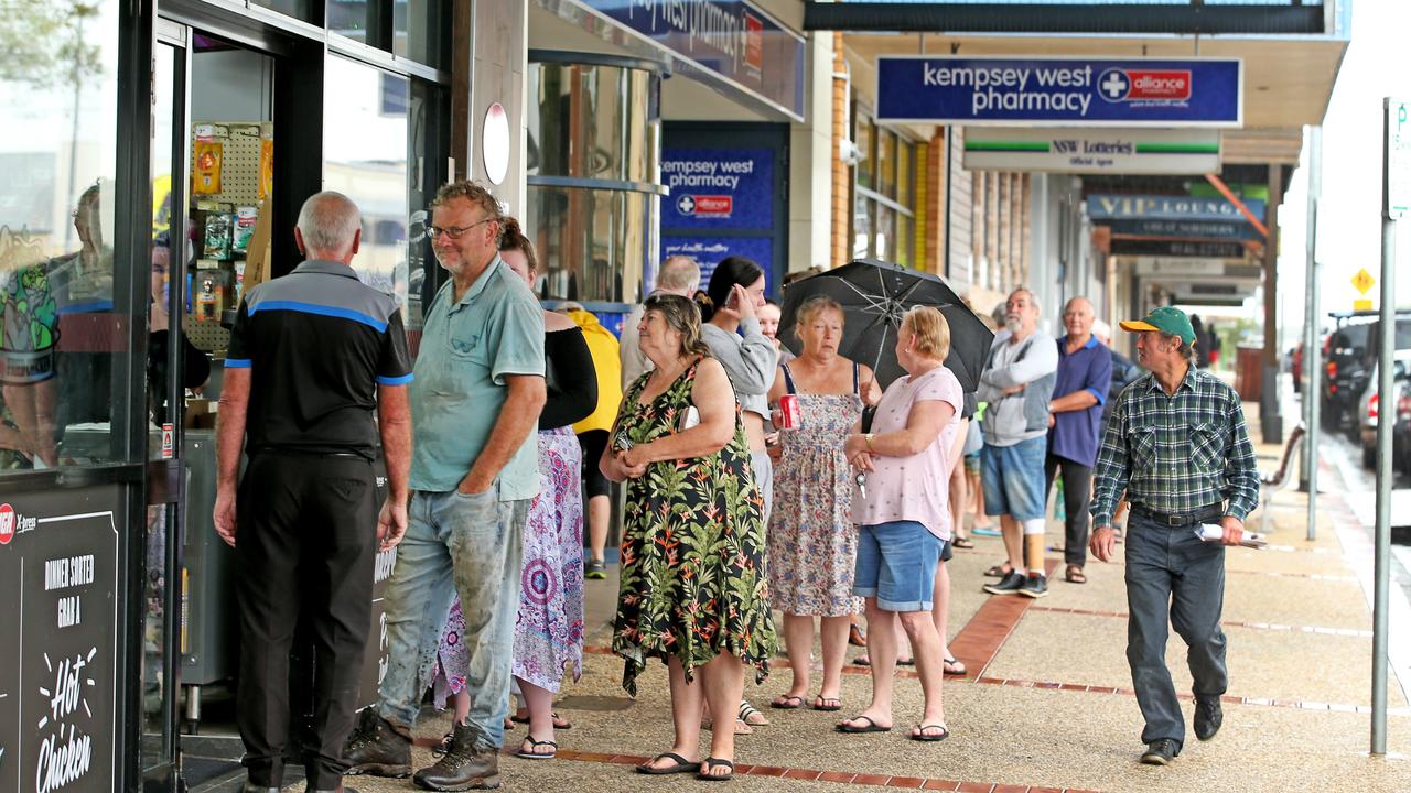 Heavy rain continues to batter the NSW mid north coast causing major flooding. Kempsey residents line up at the IGA for supplies at the only supermarket left open . Nathan Edwards