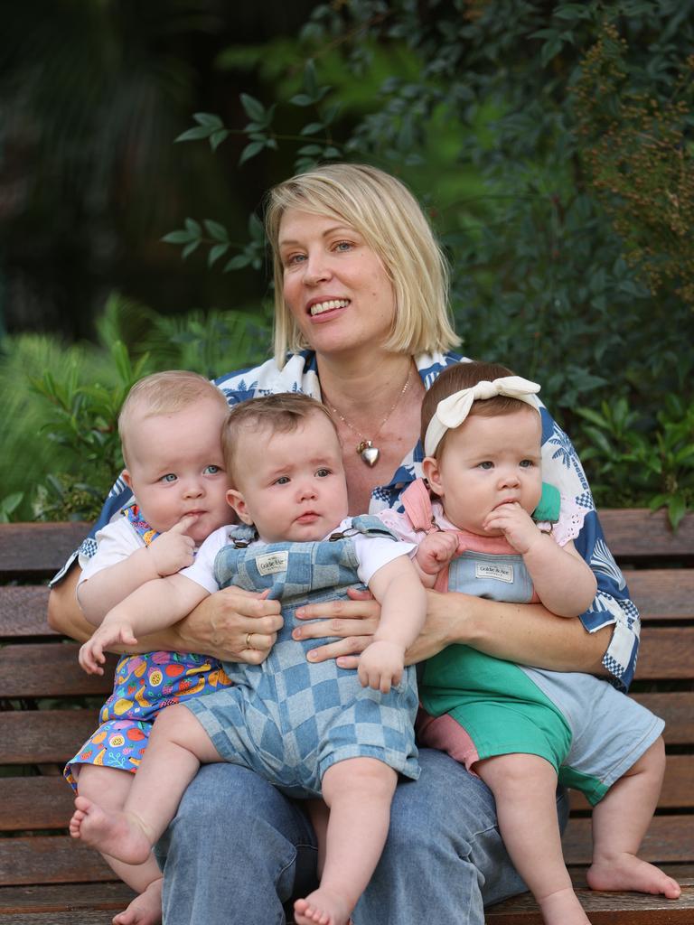 Carly Goya with her triplets August, Owen and Edie. Picture: Annette Dew