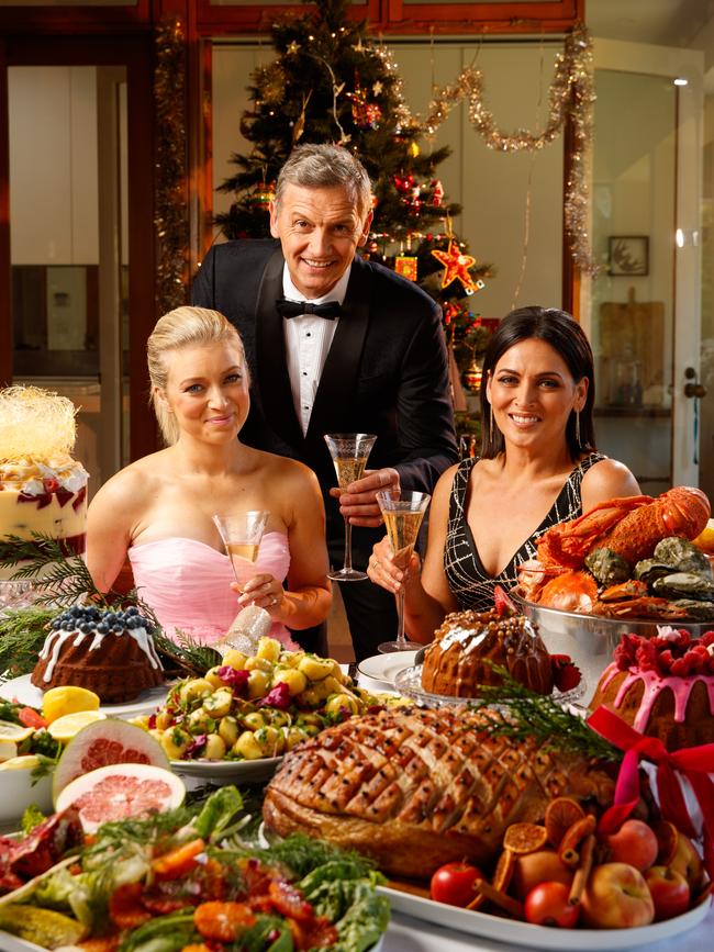 STUNNING SPREAD: Amelia Mulcahy, Mark “Soda” Soderstrom and Rosanna Mangiarelli in front of the sumptuous Christmas spread prepared by Out In The Paddock. Picture: MATT TURNER.