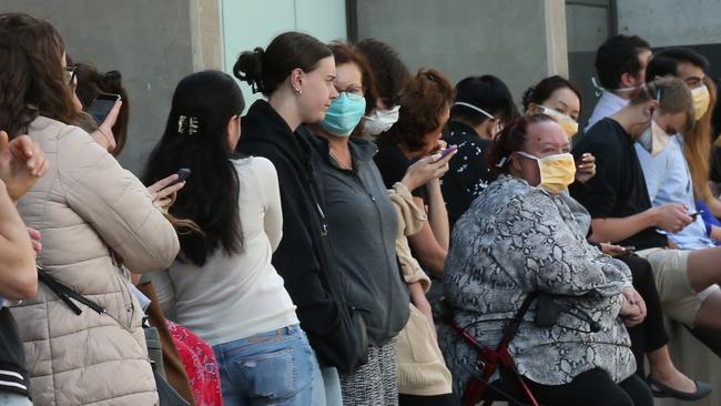 People line up outside the Royal Melbourne Hosital for coronavirus testing. Picture: AAP