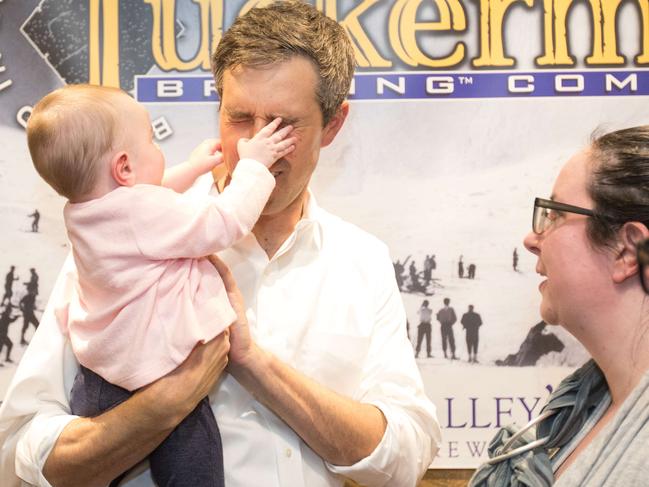 CONWAY, NH - MARCH 20: Democratic presidential candidate Beto O'Rourke has his face grabbed by a baby at a meet and greet at Tuckerman Brewing on March 20, 2019 in Conway, New Hampshire. After losing a long-shot race for U.S. Senate to Ted Cruz (R-TX), the 46-year-old O'Rourke is making his first campaign swing through New Hampshire after jumping into a crowded Democratic field.   Scott Eisen/Getty Images/AFP == FOR NEWSPAPERS, INTERNET, TELCOS & TELEVISION USE ONLY ==