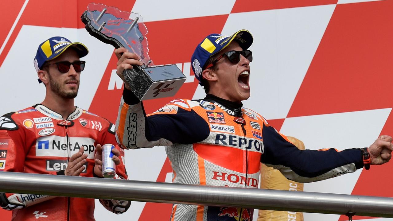 Andrea Dovizioso (L) must be getting sick of seeing Marc Marquez win.
