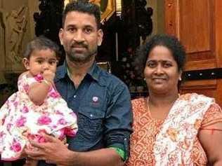 Nadesalingam holding 9-month-old Dharuniga and Priya with 2-year-old Kopiga.