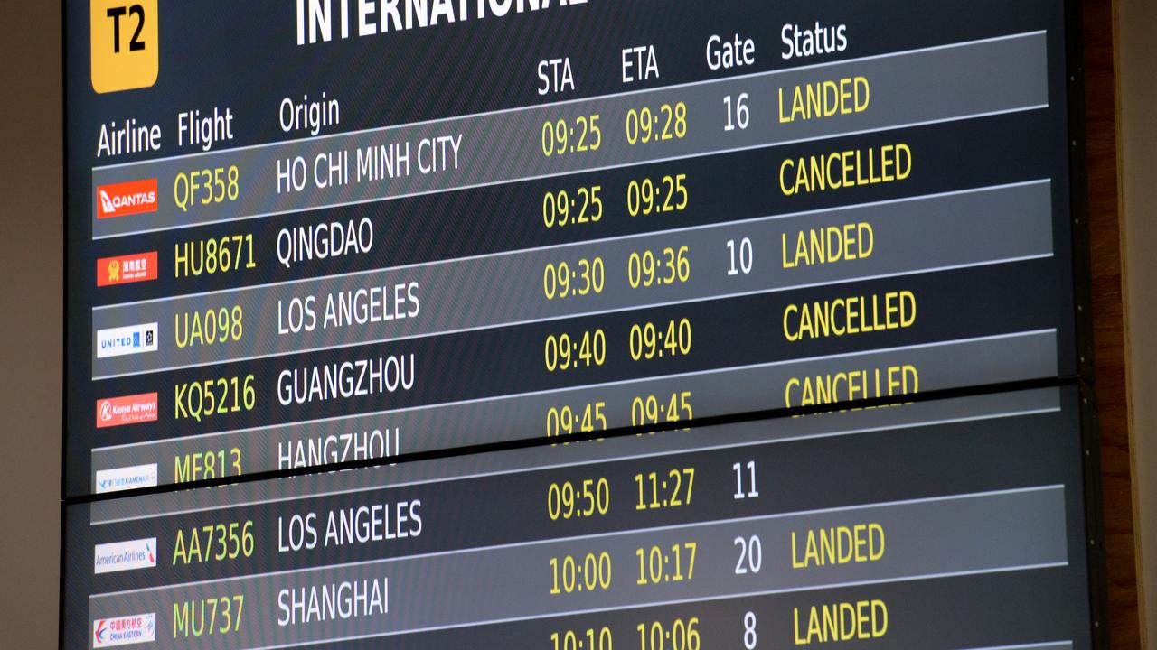 Melbourne Airport's departures board showing cancelled flights to China due to Coronavirus. Picture: Andrew Henshaw