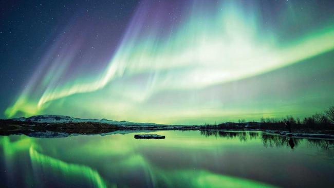 Tromso is one of many places to watch the Northern Lights blaze, as is Lake Thingvellir National Park in Iceland. Picture: sumos