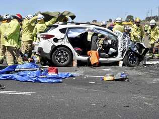 TRAGEDY: Emergency services at the scene of a fatal crash involving a B-double truck and two cars on the Warrego Highway at the intersection of Brimblecombe Rd near Oakey yesterday. Picture: Bev Lacey