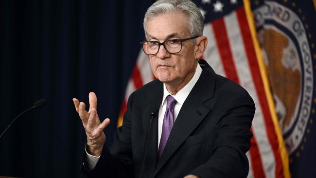 US Federal Reserve Chairman Jerome Powell holds a press conference at the end of Monetary Policy Committee meeting in Washington, DC, on December 13, 2023. The Reserve voted Wednesday to hold interest rates at a 22-year high for the third straight meeting and signaled it expects to make three cuts next year. The Fed's decided to keep its benchmark lending rate between 5.25 percent and 5.50 percent. (Photo by Brendan SMIALOWSKI / AFP)