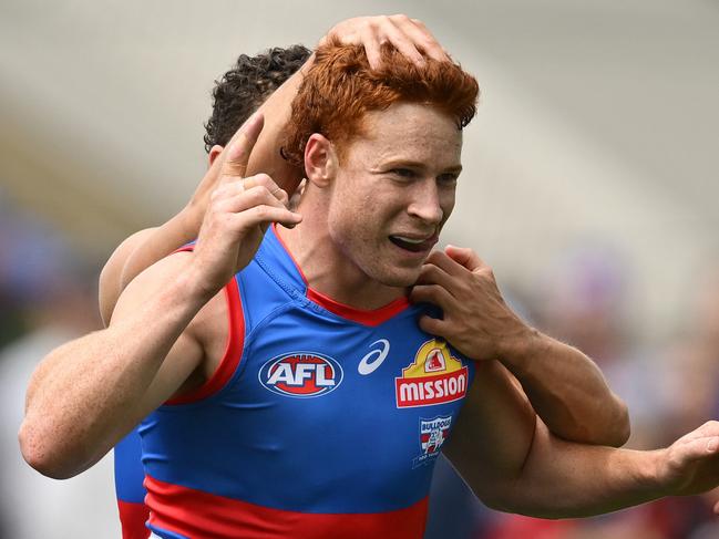 MELBOURNE, AUSTRALIA - FEBRUARY 15: Ed Richards of the Bulldogs celebrates kicking a goal during the 2025 AFL Pre-Season match between Western Bulldogs and Essendon Bombers at Whitten Oval on February 15, 2025 in Melbourne, Australia. (Photo by Quinn Rooney/Getty Images)