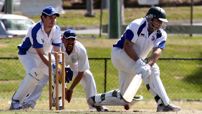 Cricket at Sir Bruce Small park, Benowa, between Surfers Paradise and Coomera. (L-R) Batsman Chris Wicks