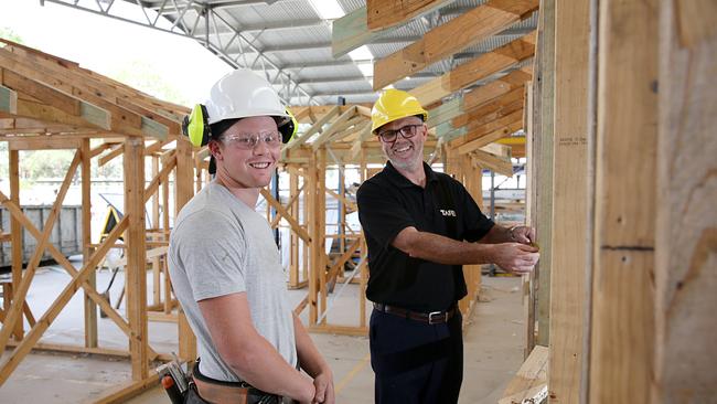 Alex Kuitert, a third year apprentice in carpentry, and TAFE team leader for carpentry Greg O'Neill. TAFE is looking to employ plenty of new carpentry teachers in the near future. Picture: Carmela Roche