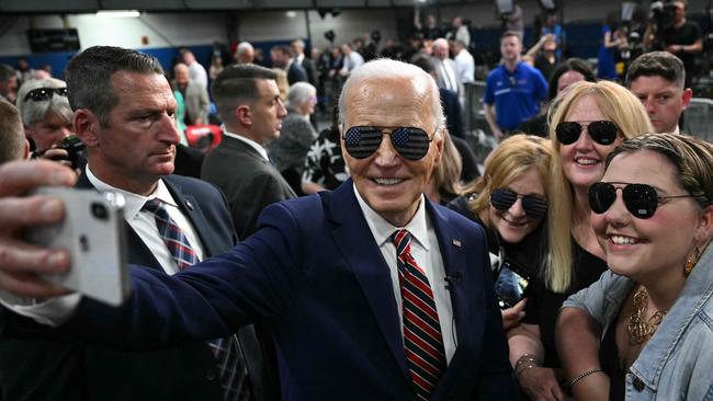 The President takes a selfie with supporters after speaking about the PACT Act, which expands coverage for veterans exposed to toxic substances in May 2024. Picture: Mandel Ngan / AFP