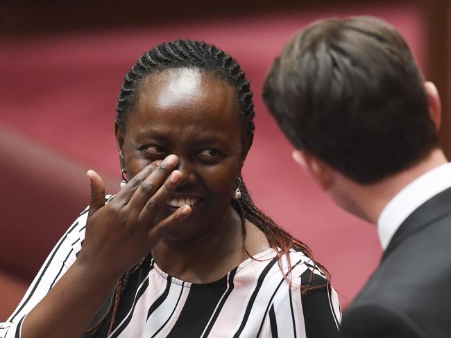 Liberal Senator Lucy Gichuhi reacts during debate in the Senate chamber at Parliament House in Canberra, Monday, September 10, 2018. (AAP Image/Lukas Coch) NO ARCHIVING