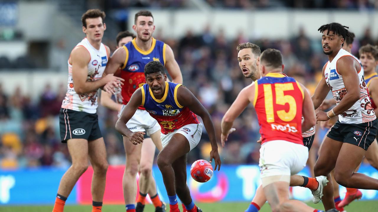 Keidean Coleman (centre) chases the ball during a game last season between the Brisbane Lions and the GWS Giants. Picture: Jono Searle/AFL Photos/via Getty Images