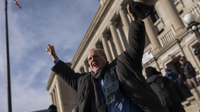 A supporter of Kyle Rittenhouse reacts as a not guilty verdict is read in front of the Kenosha County Courthouse. Picture: Getty Images.