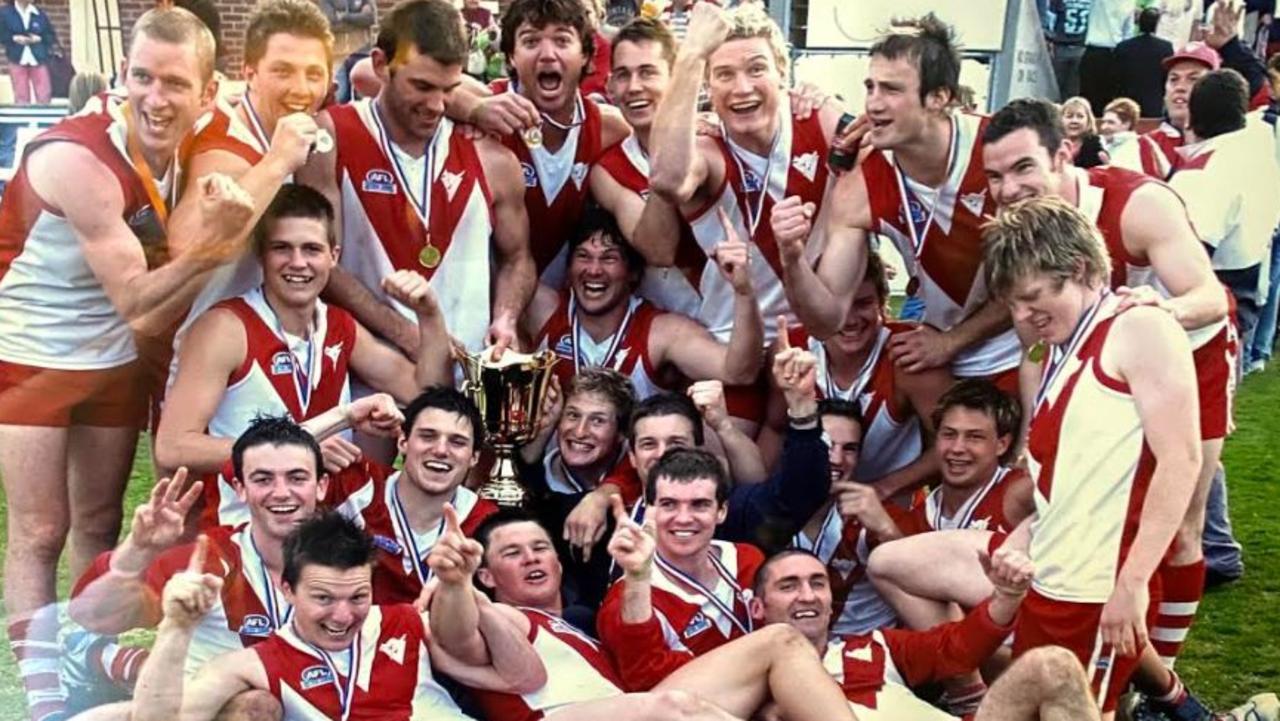 Jack Riewoldt, front right, celebrates a premiership with Clarence in Tasmania. His blonde-haired friend and mentor, Brad Dutton, is third from right at back. Picture: SUPPLIED