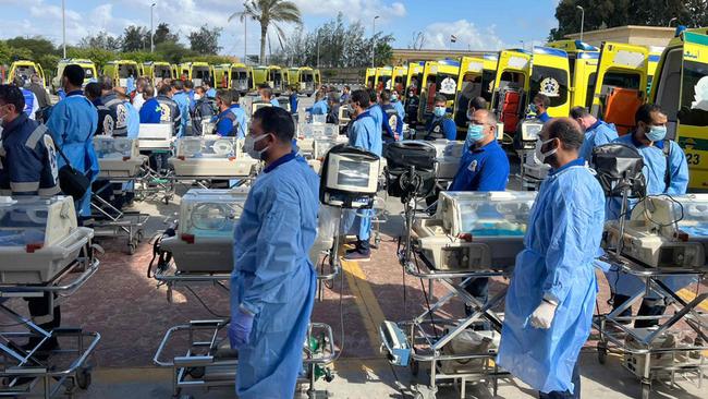 Egyptian medics stand by with incubators to receive premature Palestinian babies evacuated from Gaza on the Egyptian side of the Rafah border crossing with the Gaza Strip. Picture: AFP