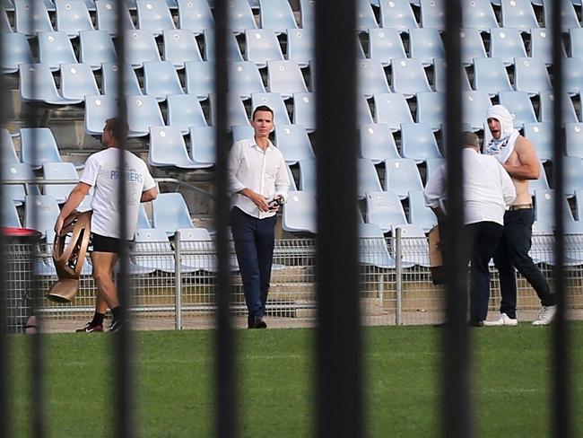 James Maloney carries the trophy across Cronulla's stadium at 7.30am. Picture: Stephen Cooper