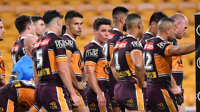 Brodie Croft (centre) of the Broncos is seen with teammates after a Luke Keary of the Roosters scored a try during the Round 4 NRL match the Brisbane Broncos and the Sydney Roosters at Suncorp Stadium in Brisbane, Thursday, June 4, 2020. (AAP Image/Darren England) NO ARCHIVING, EDITORIAL USE ONLY