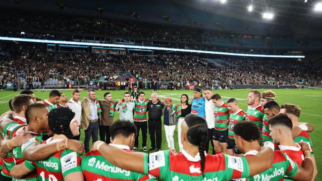 The Sattler family and Rabbitohs officials and players in a circle to pay tribute to the late John Sattler during the round four NRL match last Friday. Picture: Mark Metcalfe/Getty Images