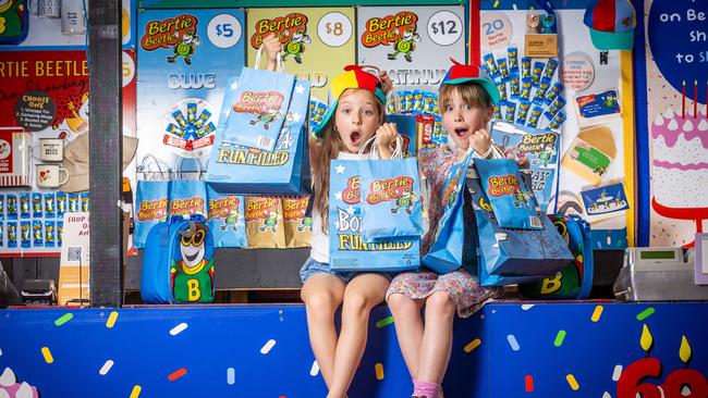 Mia Owen, 8, and Mila Forsdick, 9, check out the Bertie Beetle showbags on offer at this year’s Melbourne Royal Show. Picture: Jake Nowakowski