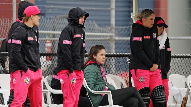 Reporter Jocelyn Airth joins the players on the boundary. Picture: AAP